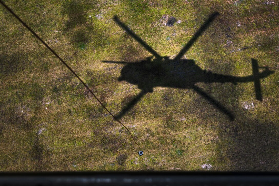 An HH-60G Pave Hawk hovers over a simulated isolated personnel at Moody Air Force Base, Ga., Aug. 8, 2019. U.S. Air Force Maj. Gen. Chad Franks, Ninth Air Force commander, flew the initial flight in his flagship aircraft, an HH-60G Pave Hawk assigned to the 41st Rescue Squadron. Franks, who on separate occasions served as the commander for the 23d Wing and 347th Rescue Group, is a command pilot with more than 3,300 hours in multiple aircraft including HC-130J Combat King II and HH-60G Pave Hawk. (U.S. Air Force photo by Airman 1st Class Taryn Butler)