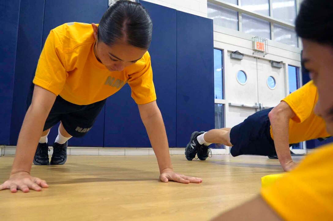 A person in a push-up position.