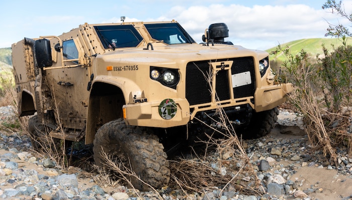 A Joint Light Tactical Vehicle displays its ability to handle multiple terrain types by physically adjusting its suspension during a demonstration at the School of Infantry West, Marine Corps Base Camp Pendleton, California, Feb. 27, 2019. Marines are able to adjust multiple drive settings of the JLTV by selecting options on an internal LCD. These settings affect how the vehicle drives in sandy, muddy, snowy or highway road conditions. The JLTV consists of multiple platforms capable of completing a variety of missions while providing increased protection and mobility for personnel across the Marine Corps.