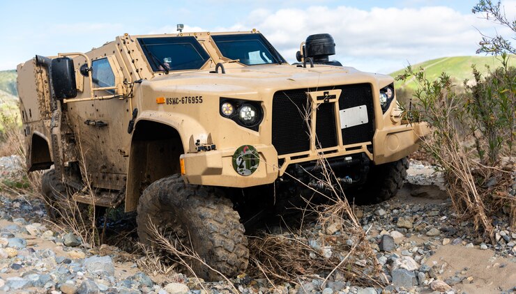 A Joint Light Tactical Vehicle displays its ability to handle multiple terrain types by physically adjusting its suspension during a demonstration at the School of Infantry West, Marine Corps Base Camp Pendleton, California, Feb. 27, 2019. Marines are able to adjust multiple drive settings of the JLTV by selecting options on an internal LCD. These settings affect how the vehicle drives in sandy, muddy, snowy or highway road conditions. The JLTV consists of multiple platforms capable of completing a variety of missions while providing increased protection and mobility for personnel across the Marine Corps.