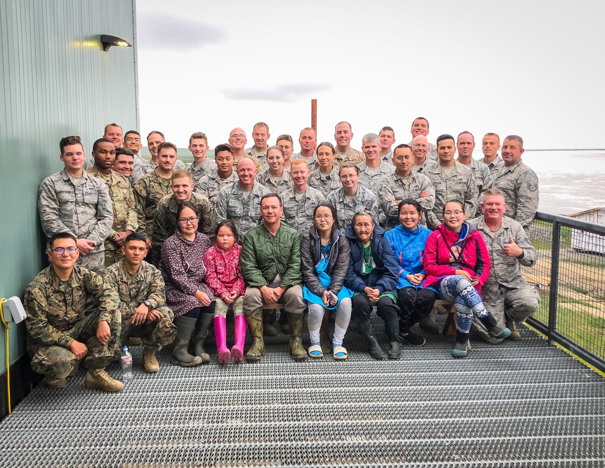 Villagers from Newtok, Alaska, pose with Air Force reservists in the 419th Civil Engineer Squadron from Hill Air Force Base, Utah, on Aug. 8.