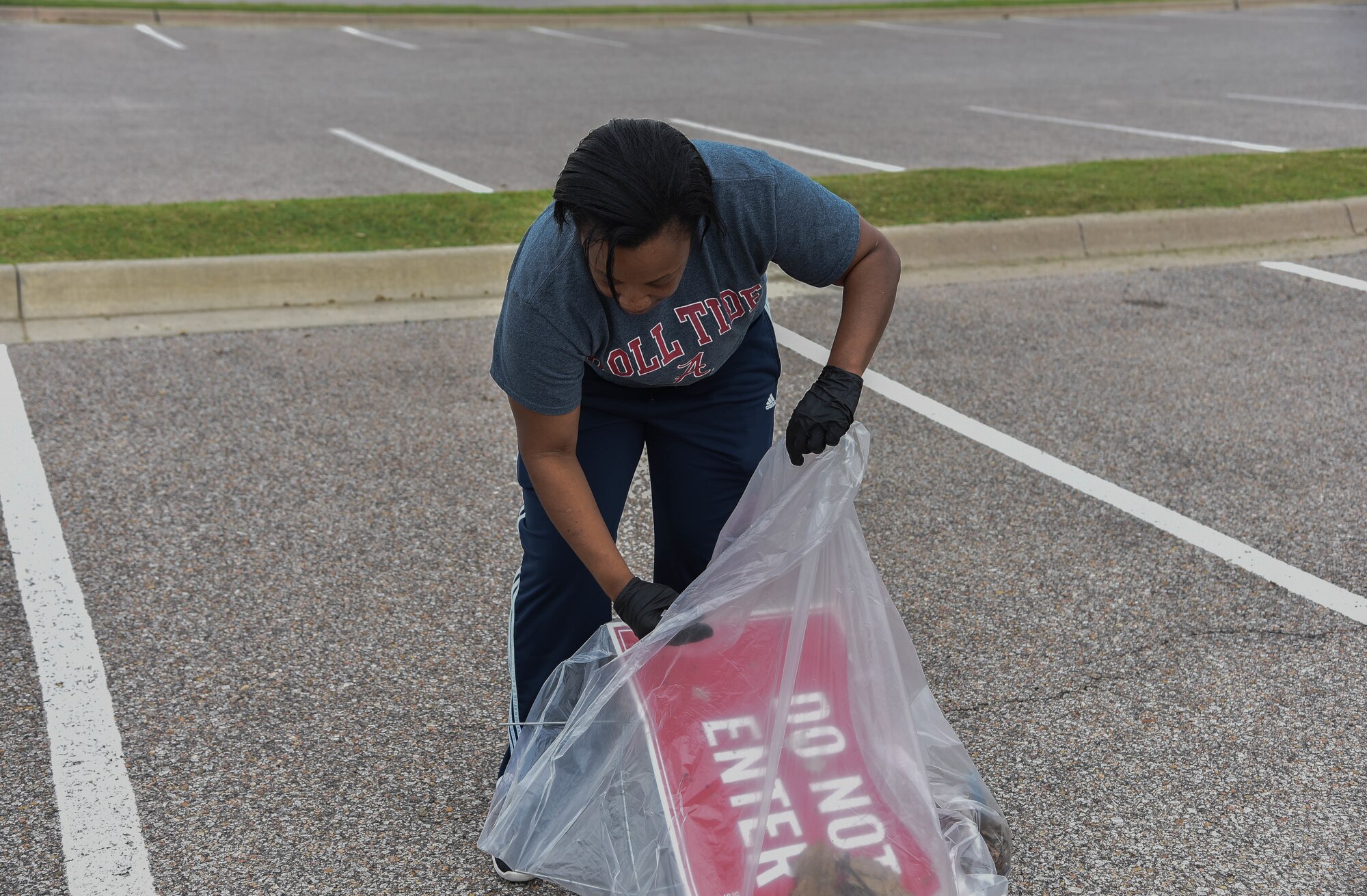 Senior Master Sgt. Latersa Jones-Crowe, 22nd Force Support Squadron sustainable services flight superintendent, led the clean up effort around the Dole Center for McConnell Pride Day August 9, 2019, at McConnell Air Force Base, Kan. More than 150 Airmen throughout the wing participated in the wing wide effort to clean McConnell. (U.S. Air Force photo by Airman 1st Class Marc A. Garcia)