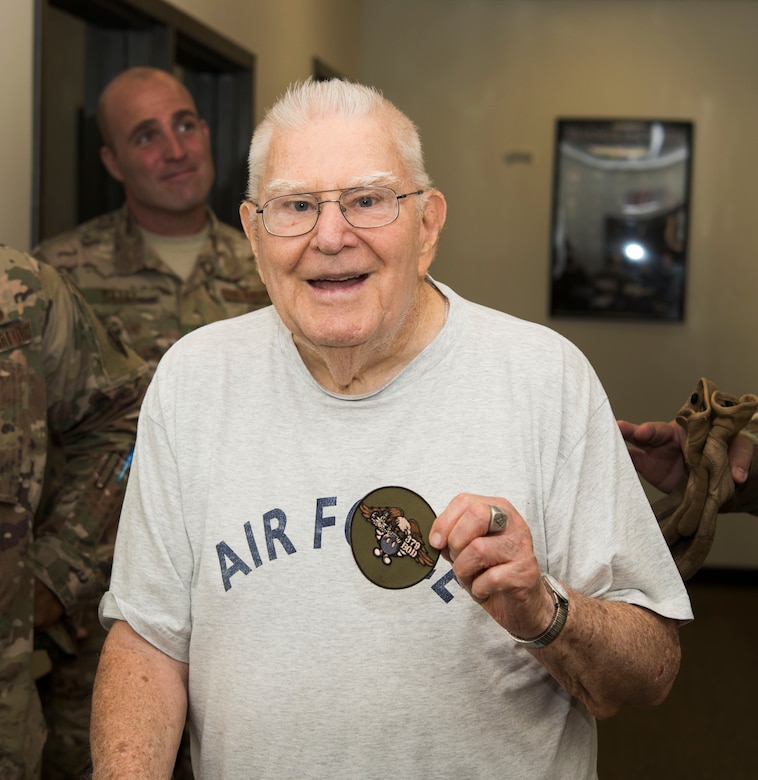 John “Jack” McCarthy, retired U.S. Air Force Explosive Ordnance Disposal technician, holds a military unit patch during a tour of the 87th Civil Engineer Squadron EOD unit on Joint Base McGuire-Dix-Lakehurst, New Jersey, Aug. 7, 2019. The EOD team presented McCarthy with a 379th EOD deployment patch to show their respect for their fellow EOD member. (U.S. Air Force photo by Airman 1st Class Ariel Owings)