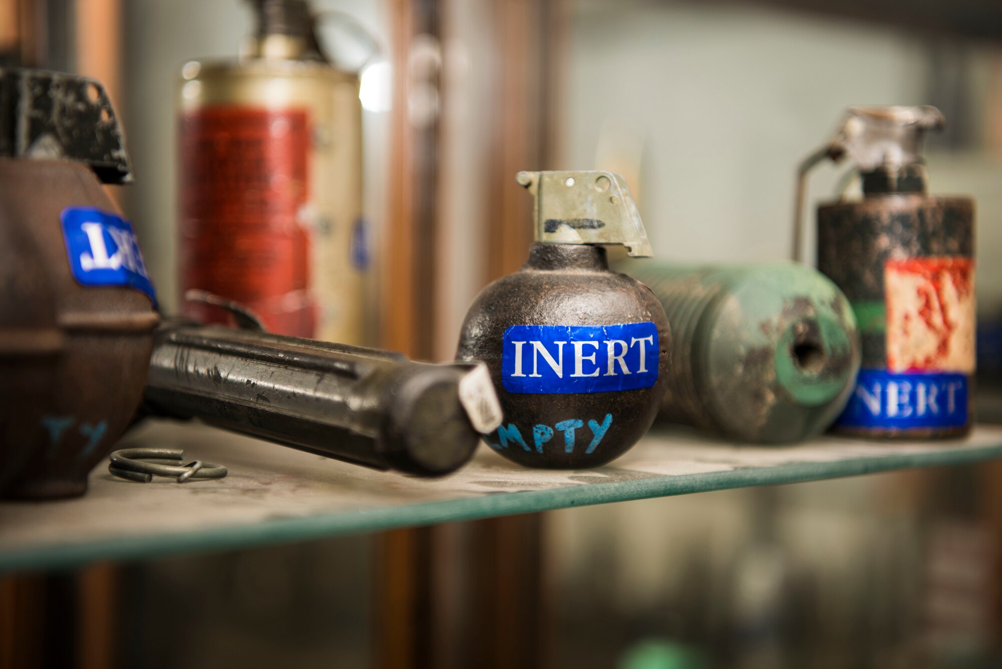 An inert ordnance sits on display in the 87th Civil Engineer Squadron Explosive Ordnance Disposal unit on Joint Base McGuire-Dix-Lakehurst, New Jersey, Aug. 7, 2019. The unit displays most of the empty cases of ordnance they have found throughout the years to show the importance of their career and to use for training purposes. (U.S. Air Force photo by Airman 1st Class Ariel Owings)