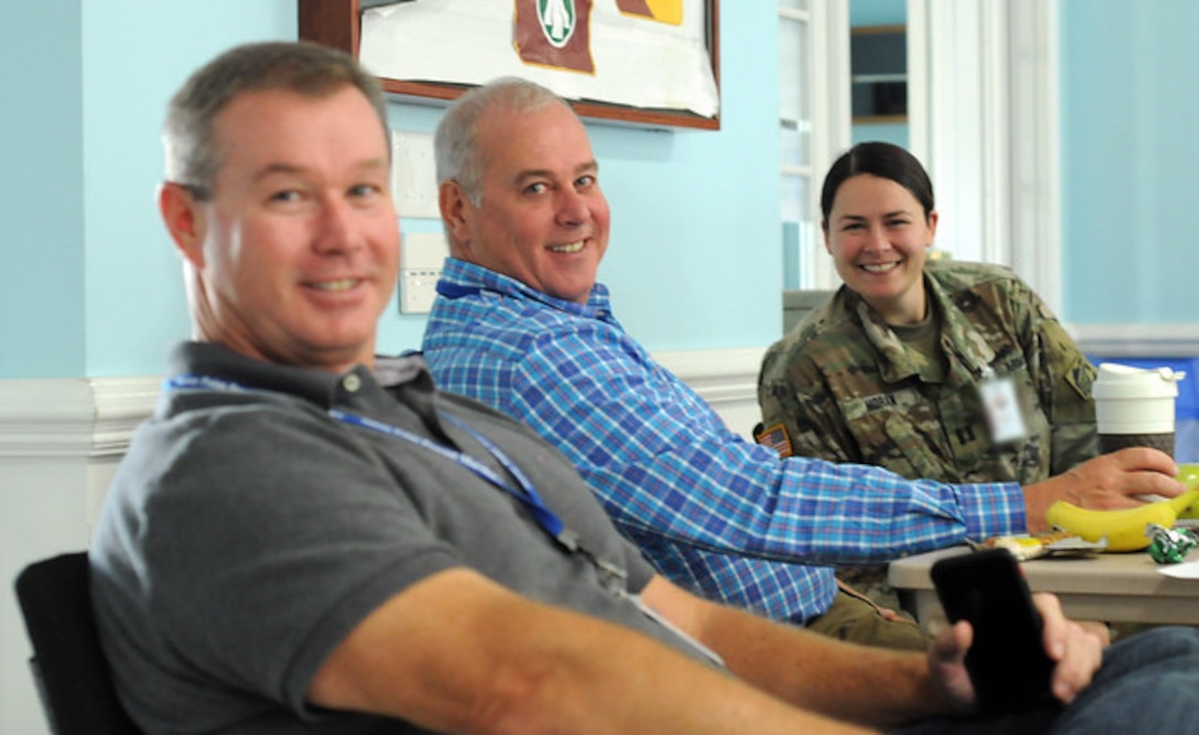 Tracy Hendren (left) Engineer Division Chief for the U.S. Army Corps of Engineers, Savannah District, Erik Blechinger (center) Deputy District Engineer and Capt. Kerry Horan, Battle Captain for the District, take a breather during a pre-construction meeting on the first contract of recovery efforts at the Military Ocean Terminal Sunny Point, N.C., Oct. 2, 2018. The recovery is in response to damages caused by Hurricane Florence. The Corps' Savannah District issued the notice to proceed with construction less than two weeks after the district was assigned the effort. The contractor, Eagle Eye Electric, LLC, will be conducting on and off installation railway repairs for the next 60 days, and is scheduled start construction Oct. 3. -U.S. Army photo by Russell Wicke