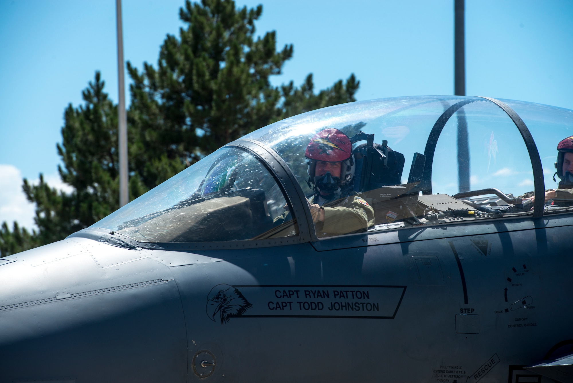 Col. Thomas Palmer, 366th Fighter Wing chief of staff, smiles at his family and friends, Aug. 2, 2019 at Mountain Home Air Force Base, Idaho. Palmer flew his last flight within an F-15E before retiring from the U.S. Air Force. (U.S. Air Force photo by Airman 1st Class Eric Brown)
