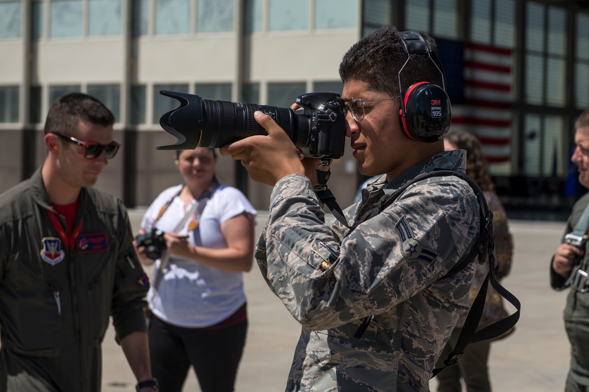 Airman 1st Class Eric Brown, 726th Air Control Squadron air traffic controller, takes a photo of Col. Thomas Palmer, 366th Fighter Wing chief of staff, exiting the F-15E Strike Eagle, Aug. 2, 2019 at Mountain Home Air Force Base, Idaho. Palmer flew his last flight within an F-15E before retiring from the U.S. Air Force. (U.S. Air Force photo by Senior Airman JaNae Capuno)