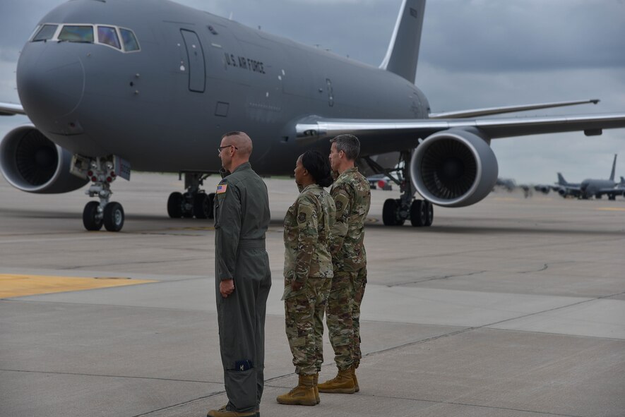 Col. Bruce Hesteltine, 931st Air Refueling Wing commander (left), Chief Master Sgt. Melissa Royster 22nd Air Refueling Wing command chief, and Col. Richard Tanner, 22nd ARW commander, salutes as the 9th KC-46A Pegasus arrives at McConnell Air Force Base, Kan. August 9, 2019. This was the 9th KC-46 to arrive at McConnell AFB since the first arrival on January 25, 2019. (U.S. Air Force photo by Airman 1st Class Marc A. Garcia)