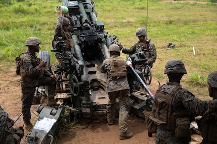 U.S. Marines with 3rd Reconnaissance Battalion, and Marines with 3rd Battalion, 12th Marine Regiment, 3rd Marine Division, prepare to fire an M777 Howitzer during the Artillery Relocation Training Program in Ojojihara, Japan, July 30, 2019. ARTP is an exercise in Japan that provides artillery Marines an opportunity to train and enhance their capabilities. (U.S. Marine Corps photo by Lance Cpl. Christine Phelps)