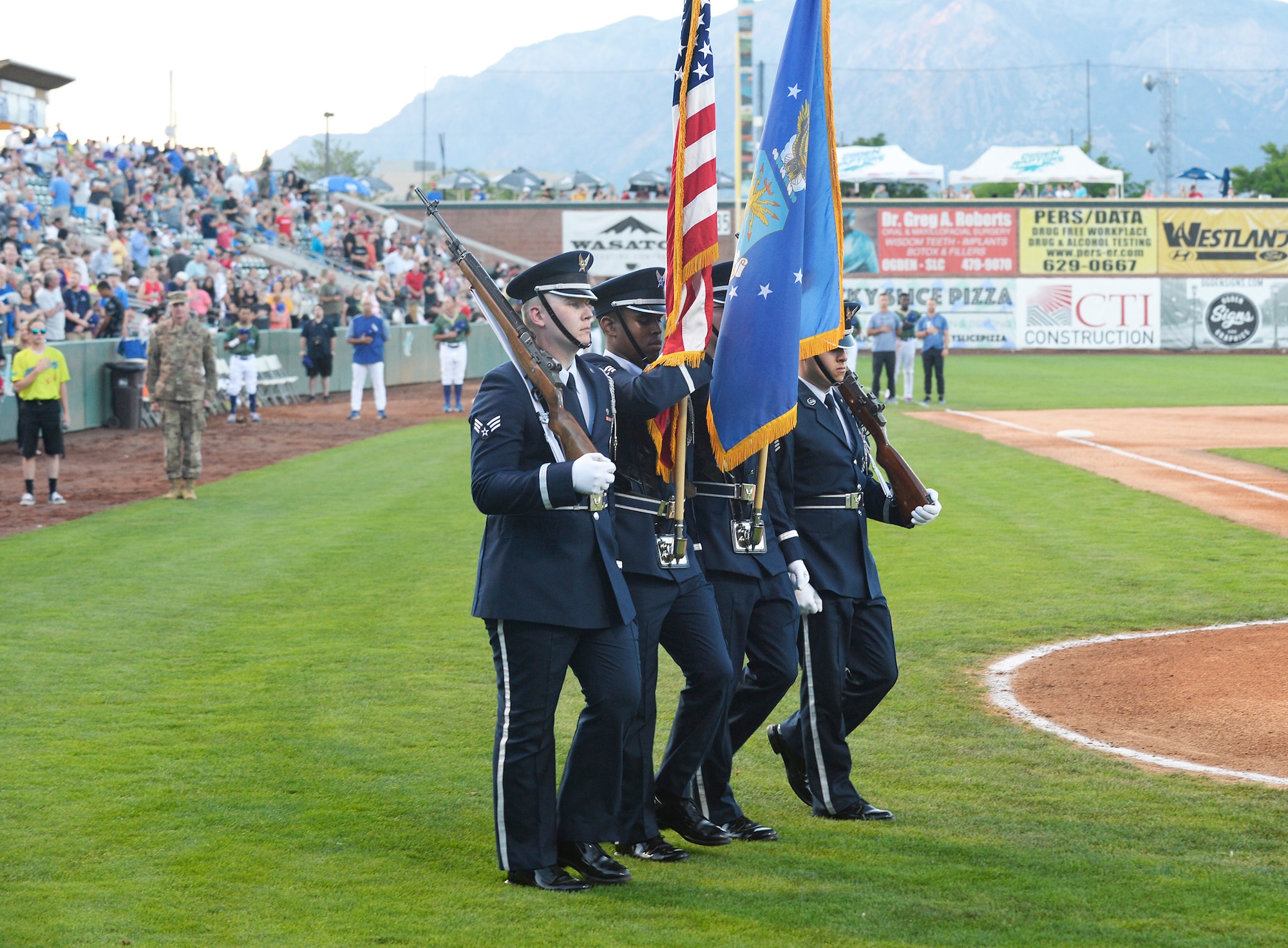 The Hill Air Force Base Honor Guard marches onto the field to present the colors during the Aug. 9, 2019, Military Appreciation Night with the Ogden Raptors and Idaho Falls Chuckars at Lindquist Field in Ogden, Utah. Each year, the Raptors team up with the Top of Utah Military Affairs Committee to offer tickets to Hill Air Force Base personnel and their families. (U.S. Air Force photo by David Perry)
