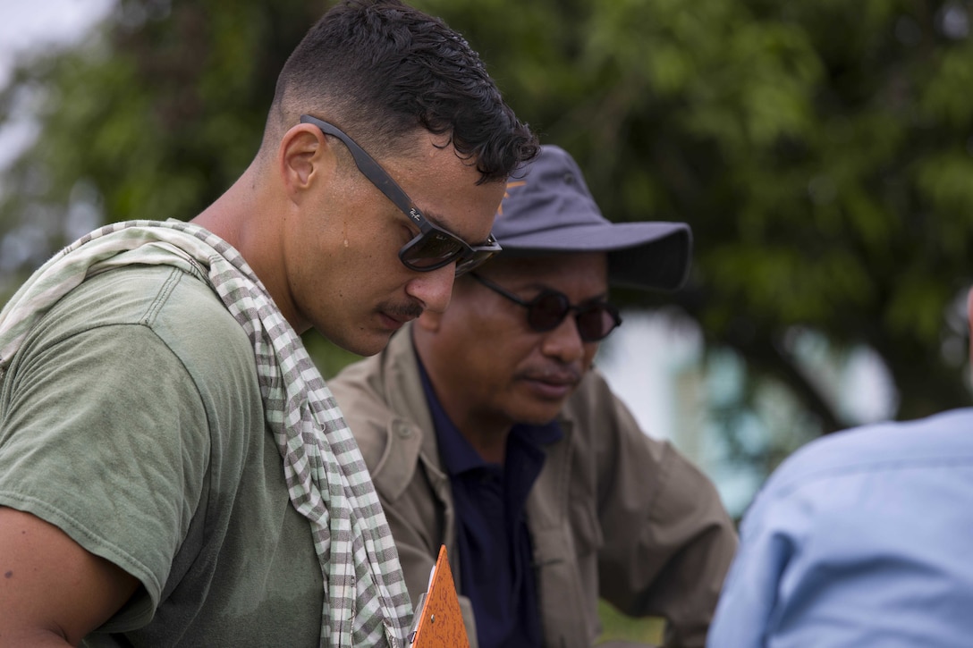 U.S. Marine Corps Sgt. Dillon M. Medeiros, left, conducts Explosive Ordnance Disposal (EOD) Level 2 instruction for EOD Technicians with Cambodian Mine Action Center during Humanitarian Mine Actions (HMA) Cambodia in Kampong Chhnang, Cambodia, July 31, 2019. HMAs are reoccurring events that instruct partner nations’ on tactics, techniques and procedures. This instruction on EOD and tactical combat casualty care capabilities will save lives and relieve human suffering. Medeiros, a native of Honokua, Hawaii, is an Explosive Ordnance Disposal Technician with 3rd EOD Co., 9th Engineer Support Battalion, 3rd Marine Logistics Group. (U.S. Marine Corps photo by Sgt Stephanie Cervantes)