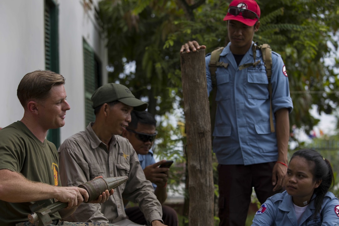 U.S. Marine Corps Sgt. Matthew K. Sponagle, left, provides feedback during Explosive Ordnance Disposal (EOD) Level 2 instruction for EOD Technicians with Cambodian Mine Action Center during Humanitarian Mine Actions (HMA) Cambodia in Kampong Chhnang, Cambodia, July 31, 2019. HMAs are reoccurring events that instruct partner nations’ on tactics, techniques and procedures. This instruction on EOD and tactical combat casualty care capabilities will save lives and relieve human suffering. Sponagle, a native of Reading, Pennsylvania, is an Explosive Ordnance Disposal Technician with 3rd EOD Co., 9th Engineer Support Battalion, 3rd Marine Logistics Group. (U.S. Marine Corps photo by Sgt Stephanie Cervantes)