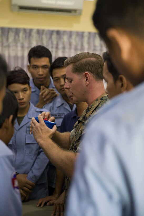 U.S. Marine Corps Sgt. Matthew K. Sponagle explains the components of the Advanced Ordnance Teaching Material during Explosive Ordnance Disposal (EOD) Level 2 instruction for EOD Technicians with Cambodian Mine Action Center during Humanitarian Mine Actions (HMA) Cambodia in Kampong Chhnang, Cambodia, Aug 1, 2019. HMAs are reoccurring events that instruct partner nations’ on tactics, techniques and procedures. This instruction on EOD and tactical combat casualty care capabilities will save lives and relieve human suffering. Sponagle, a native of Reading, Pennsylvania, is an Explosive Ordnance Disposal Technician with 3rd EOD Co., 9th Engineer Support Battalion, 3rd Marine Logistics Group. (U.S. Marine Corps photo by Sgt Stephanie Cervantes)