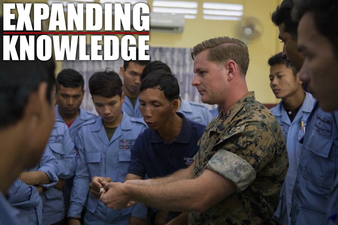 U.S. Marine Corps Sgt. Matthew K. Sponagle explains the components of the Advanced Ordnance Teaching Material during Explosive Ordnance Disposal (EOD) Level 2 instruction for EOD Technicians with Cambodian Mine Action Center during Humanitarian Mine Actions (HMA) Cambodia in Kampong Chhnang, Cambodia, Aug 1, 2019. HMAs are reoccurring events that instruct partner nations’ on tactics, techniques and procedures. This instruction on EOD and tactical combat casualty care capabilities will save lives and relieve human suffering. Sponagle, a native of Reading, Pennsylvania, is an Explosive Ordnance Disposal Technician with 3rd EOD Co., 9th Engineer Support Battalion, 3rd Marine Logistics Group. (U.S. Marine Corps photo by Sgt Stephanie Cervantes)
