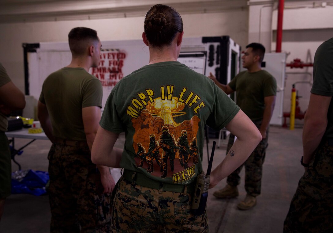U.S. Marines receive a situational brief for a sensitive site exploitation training exercise at Camp Kinser, Okinawa, Japan, August 1, 2019.  The Marines conduct weekly training to improve their ability to operate in unknown chemical, biological, radiological and nuclear environments. The Marines are CBRN defense specialists with G-3, Enhanced CBRN Section, Combat Logistics Regiment 37, 3rd Marine Logistics Group. (U.S. Marine Corps photo by Lance Cpl. Carla E. O)