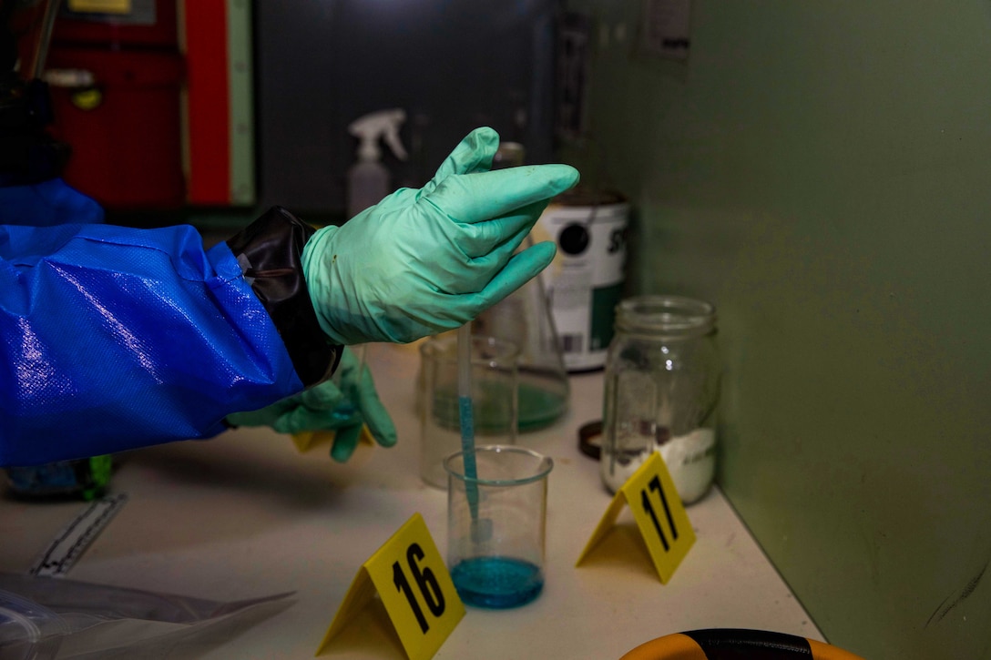 U.S. Marine Corps Lance Cpl. Mikelle A. Thompson uses a pipette to sample an unknown substance during a training exercise at Camp Kinser, Okinawa, Japan, August 1, 2019. Fresh gloves and the use of sterile equipment prevent contamination of the substances collected. Thompson, a native of Philadelphia, Pennsylvania, is a CBRN defense specialist with G-3, Enhanced CBRN Section, Combat Logistics Regiment 37, 3rd Marine Logistics Group. (U.S. Marine Corps photo by Lance Cpl. Carla E. O)