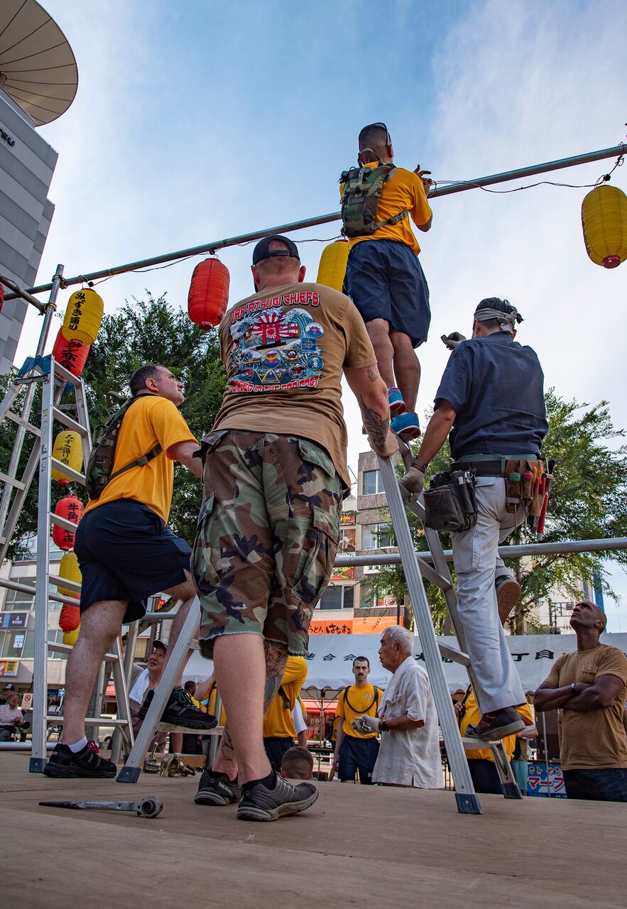 YAMATO, Japan (Aug. 09, 2019) Chief Petty Officers (CPO), CPO selectees and citizens from Yamato city assemble the Yagura stage for the city's annual Yamato Furusato summer festival. The festival featured dance routines performed by members of the local community as well as Naval Air Facility Atsugi's Bon Odori dancers.