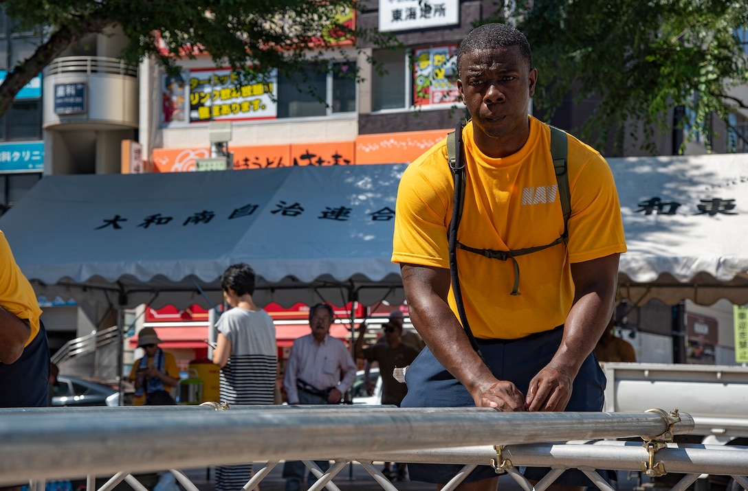 YAMATO, Japan (Aug. 09, 2019) Legalman 1st Class Ryan Pickens, from Kaufman, Texas takes part in assembling the Yagura stage for Yamato city's annual Yamato Furusato summer festival. The festival featured dance routines performed by members of the local community as well as Naval Air Facility Atsugi's Bon Odori dancers.