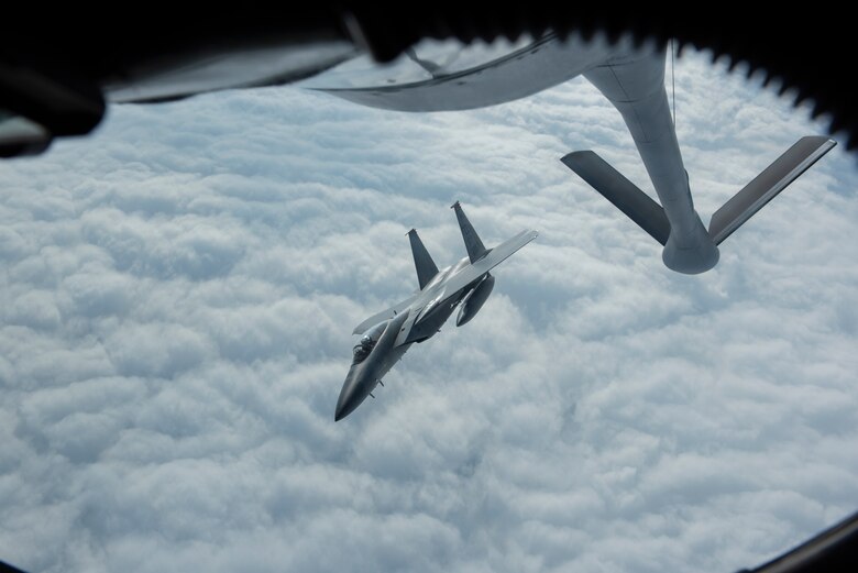 A 67th Fighter Squadron F-15C Eagle from Kadena Air Base, Japan, flies away from a 909th Air Refueling Squadron KC-135 Stratotanker after conducting aerial refueling during RED FLAG-Alaska 19-3 at Eielson Air Force Base, Alaska, Aug. 7, 2019.