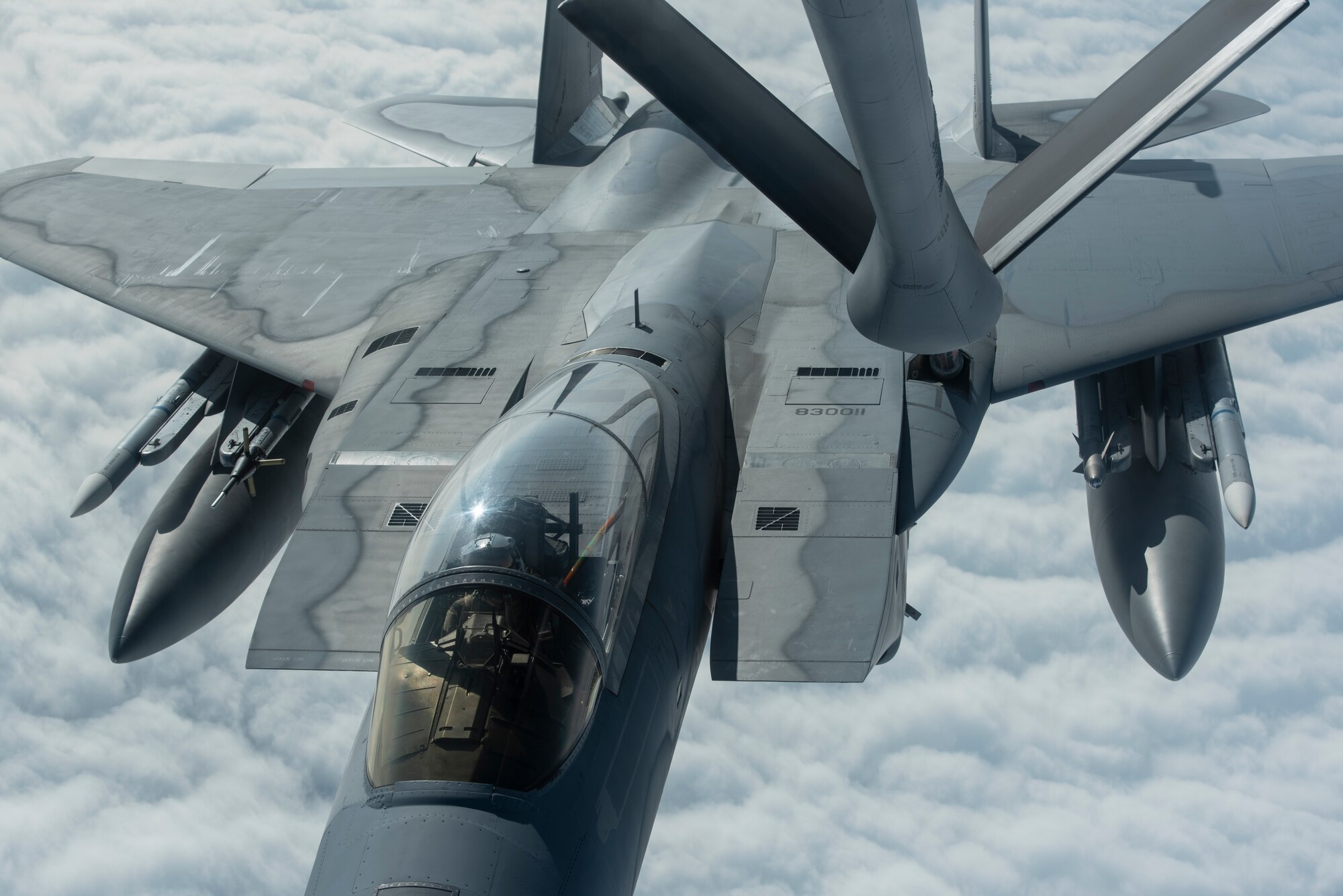 A 67th Fighter Squadron F-15C Eagle and 909th Air Refueling Squadron KC-135 Stratotanker, both from Kadena Air Base, Japan, conduct aerial refueling during RED FLAG-Alaska 19-3 at Eielson Air Force Base, Alaska, Aug. 7, 2019.