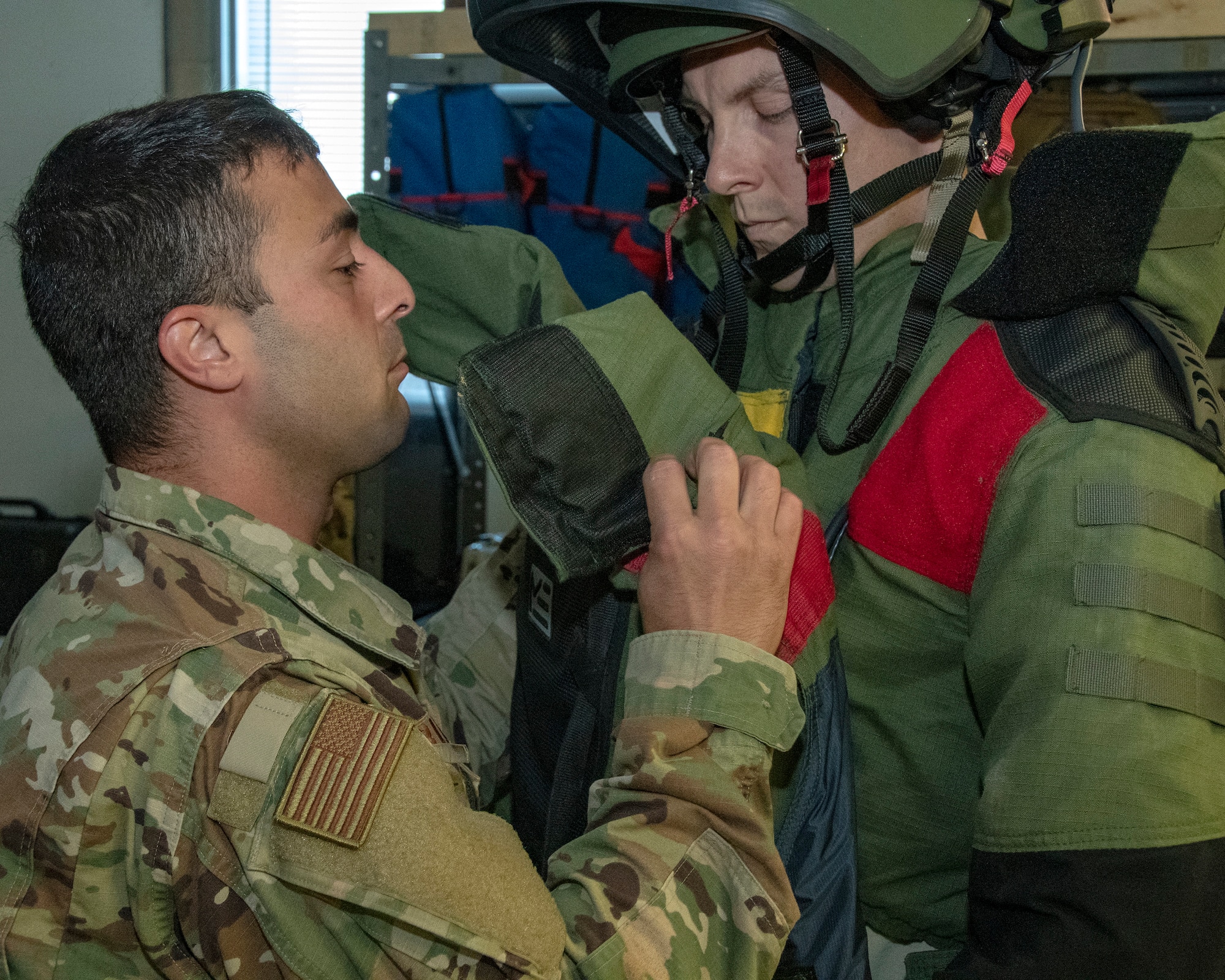 MSgt Mark Jurakovich from the 166th Airlift Wing Explosive Ordinance Disposal Unit, Delaware Air National Guard and the Outstanding Airman of the Year in the category of Senior Noncommissioned officer gets assistance with EOD bomb suit, Jun 6, 2019. OAY is an ANG command chief program to recognize the best of the best Airman throughout the ANG enterprise. (U.S. Air National Guard photo by Master Sgt. David J. Fenner)