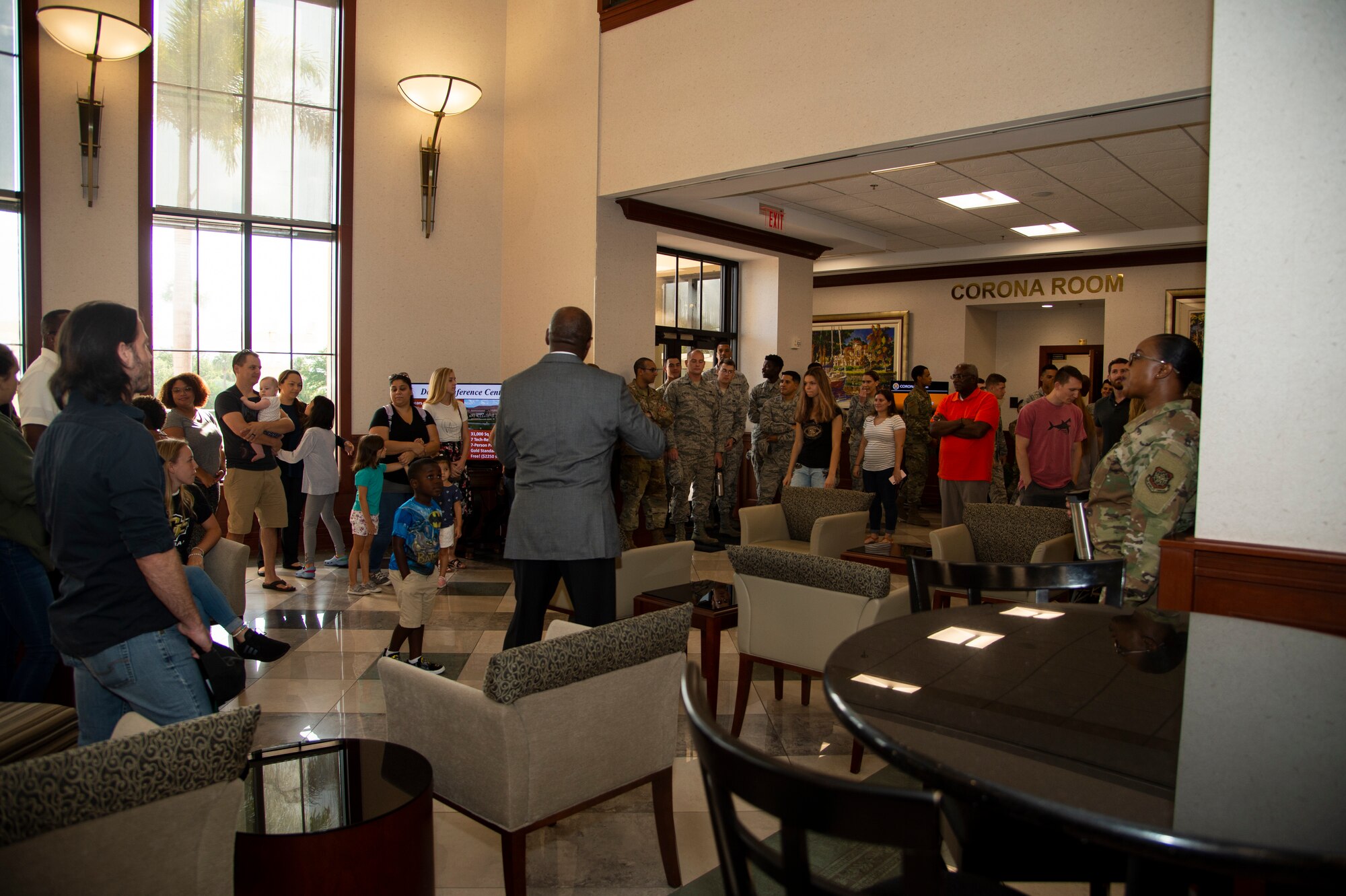 Airmen assigned to the 6th Communications Squadron and their families receive a briefing about the importance of the Davis Conference Center during an open house at MacDill Air Force Base, Fla., August 9, 2019.
