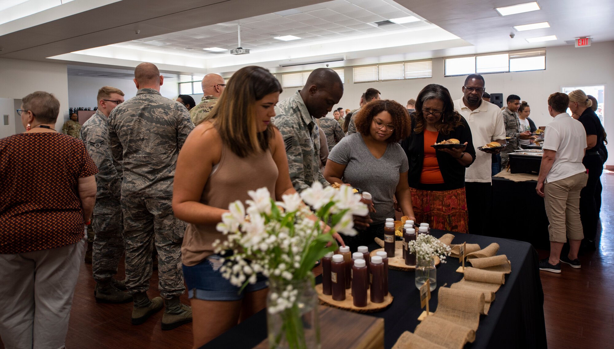 Airmen assigned to the 6th Communications Squadron and their family member’s line up to eat at the Chapel following an open house at MacDill Air Force Base, Fla., August 9, 2019.