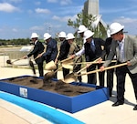 Mark Correll (third from right), deputy assistance secretary of the Air Force for Environment, Safety, and Infrastructure, and Brig. Gen. Laura Lenderman (fifth from right), commander of the 502nd Air Base Wing and Joint Base San Antonio, participate in a ceremonial dig Aug. 7 to start the San Antonio Water System sewer pipeline project that will improve service for more than 500,000 people, including Airmen and civilians working and living on JBSA-Lackland. San Antonio Mayor Ron Nirenberg (far left) and U.S. Congressmen Henry Cuellar (third from left) and Will Hurd (fourth from right) took part in the ceremony.
