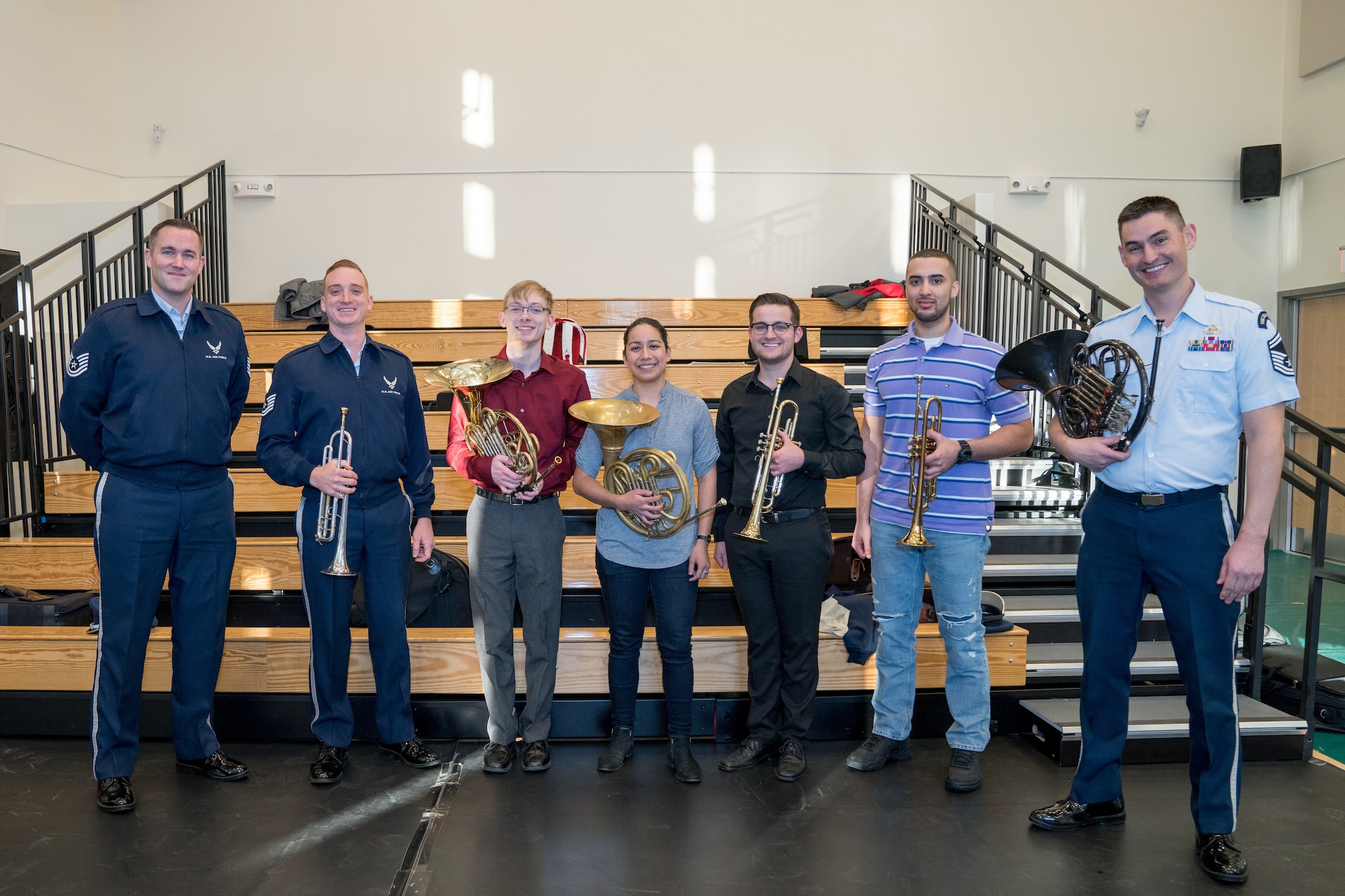 French horn student, Andrew Stump (third from left), poses with other brass instrumentalists during a rehearsal break at the Rachel M. Schlesinger Concert Hall and Arts Center in Alexandria, Virginia. The rehearsal was part of The U.S. Air Force Band's 2019 Collegiate Symposium, which afforded Stump and his father, clarinetist Senior Master Sgt. David Stump, the unique opportunity to perform together on stage for the final concert on Saturday, Feb. 2, 2019. (U.S. Air Force Photo by MSgt Brandon Chaney)