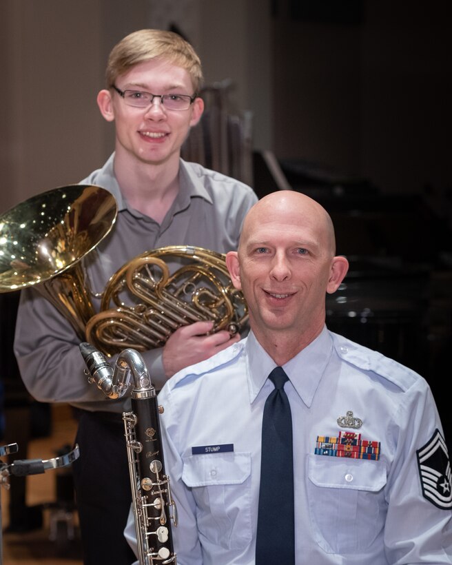 U.S. Air Force Band clarinetist, Senior Master Sgt. David Stump, poses with his son, Andrew Stump, during a rehearsal break on Joint Base Anacostia-Bolling. The rehearsal was part of the 2019 Collegiate Symposium, and it afforded the father and son a unique opportunity to perform together on Saturday, Feb. 4, 2019, at the Rachel M. Schlesinger Concert Hall and Arts Center in Alexandria, Virginia. (U.S. Air Force Photo by MSgt Brandon Chaney)