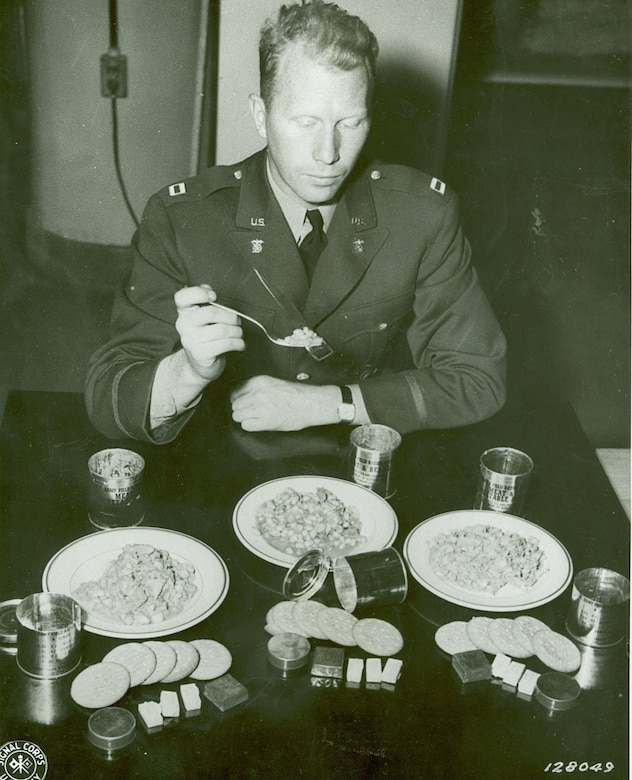 A soldier eats food.