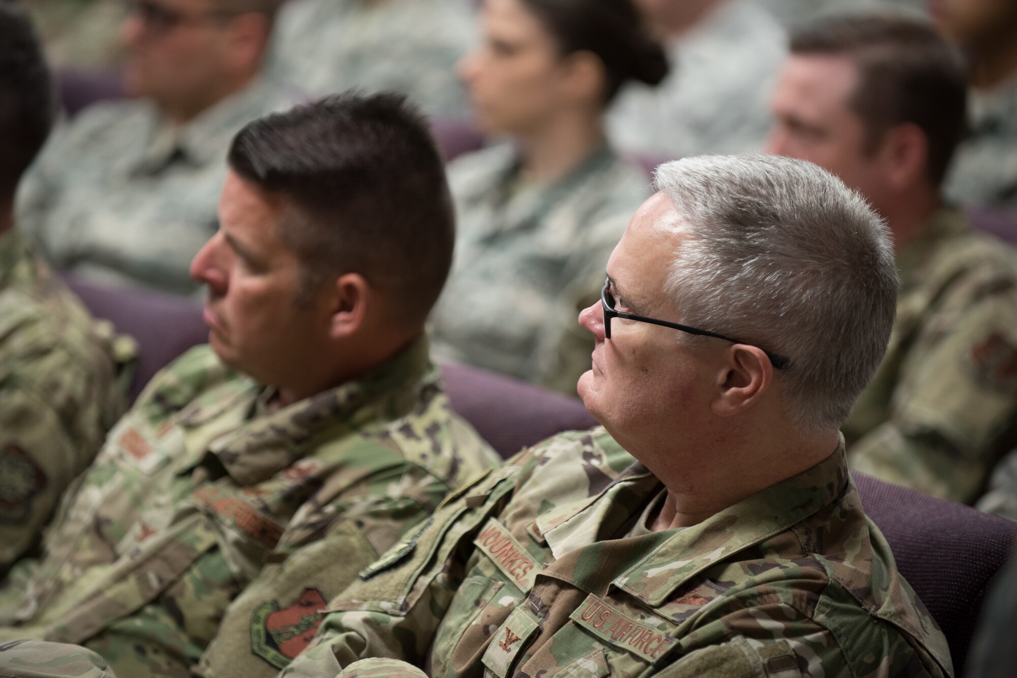 Col. David Mounkes, commander of the 123rd Airlift Wing, listens to Lt. Gen. L. Scott Rice, director of the Air National Guard, during a town hall meeting at the Kentucky Air National Guard Base in Louisville, Ky. Aug. 10, 2019. Rice took questions from the audience and discussed a variety of topics, including C-130 aircraft modernization, expansion of the Active Guard and Reserve program, and potential drawdowns in the medical service corps. (U.S. Air National Guard photo by Dale Greer)