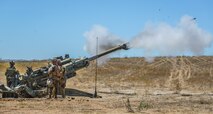 U.S. Marines with Kilo Battery, 3rd Battalion, 11th Marine Regiment, 1st Marine Division, fire an M777 Howitzer in a 'Top Gun' competition between batteries during Fire Exercise (FIREX) 19 at Marine Corps Base Camp Pendleton, Calif., July 27, 2019. FIREX 19 is a regimental-level exercise designed to improve internal standard operating procedures and allow multiple batteries to train together in preparation for Steel Knight, an annual combat readiness exercise. (U.S. Marine Corps photo by Lance Cpl. Ana S. Madrigal)