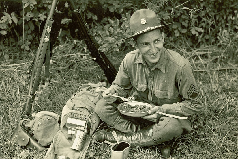 A soldier eats C-Rations.