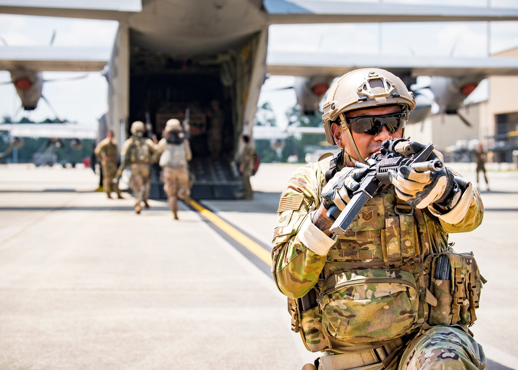 Tech. Sgt. Chris Zavala, right, 822d Base Defense Squadron (BDS) squad leader, defends his position during a tactical demonstration, Aug. 9, 2019, at Moody Air Force Base, Ga. Airmen from the 820th Base Defense Group did the tactical demo for Maj. Gen. Chad Franks, 9th Air Force commander. Franks has served on separate occasions as the commander for the 23d Wing and 347th Rescue Group and is a command pilot with more than 3,300 hours in multiple aircraft including HC-130J Combat King II and HH-60G Pave Hawk. (U.S. Air Force photo by Airman 1st Class Eugene Oliver)