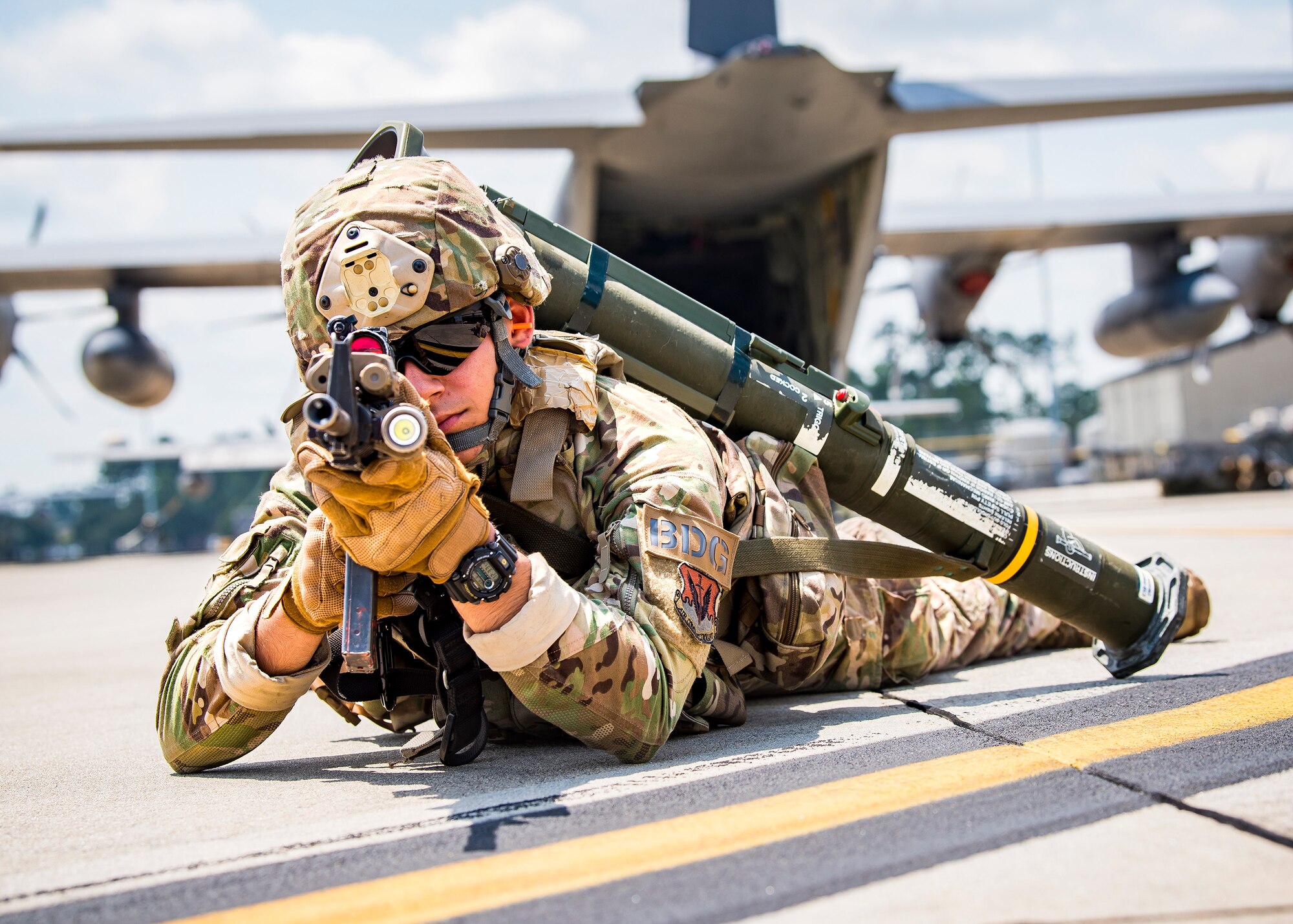 Airman Lucas Santos, 822d Base Defense Squadron fire team member, looks down the sight of an M4 Carbine during a tactical demonstration, Aug. 9, 2019, at Moody Air Force Base, Ga. Airmen from the 820th Base Defense Group did the tactical demo for Maj. Gen. Chad Franks, 9th Air Force commander. Franks has served on separate occasions as the commander for the 23d Wing and 347th Rescue Group and is a command pilot with more than 3,300 hours in multiple aircraft including HC-130J Combat King II and HH-60G Pave Hawk. (U.S. Air Force photo by Airman 1st Class Eugene Oliver)