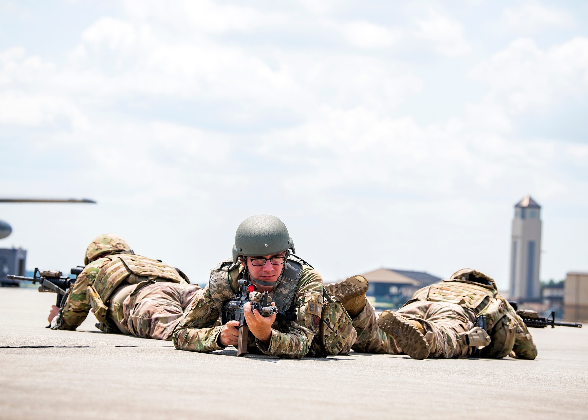 Airmen from the 820th Base Defense Group (BDG), hold their position during a tactical demonstration, Aug. 9, 2019, at Moody Air Force Base, Ga. Airmen from the 820th Base Defense Group did the tactical demo for Maj. Gen. Chad Franks, 9th Air Force commander. Franks has served on separate occasions as the commander for the 23d Wing and 347th Rescue Group and is a command pilot with more than 3,300 hours in multiple aircraft including HC-130J Combat King II and HH-60G Pave Hawk. (U.S. Air Force photo by Airman 1st Class Eugene Oliver)
