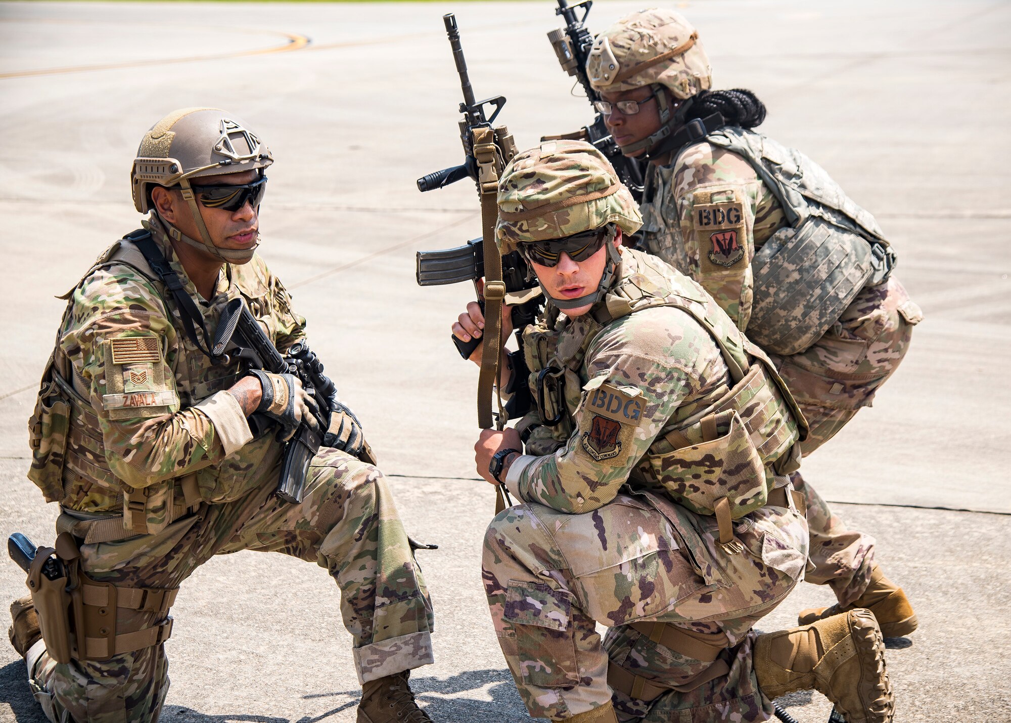 Tech. Sgt. Chris Zavala, left, 822d Base Defense Squadron (BDS) squad leader, gives command to Airmen from the 822 BDS during a tactical demonstration, Aug. 9, 2019, at Moody Air Force Base, Ga. Airmen from the 820th Base Defense Group did the tactical demo for Maj. Gen. Chad Franks, 9th Air Force commander. Franks has served on separate occasions as the commander for the 23d Wing and 347th Rescue Group and is a command pilot with more than 3,300 hours in multiple aircraft including HC-130J Combat King II and HH-60G Pave Hawk. (U.S. Air Force photo by Airman 1st Class Eugene Oliver)