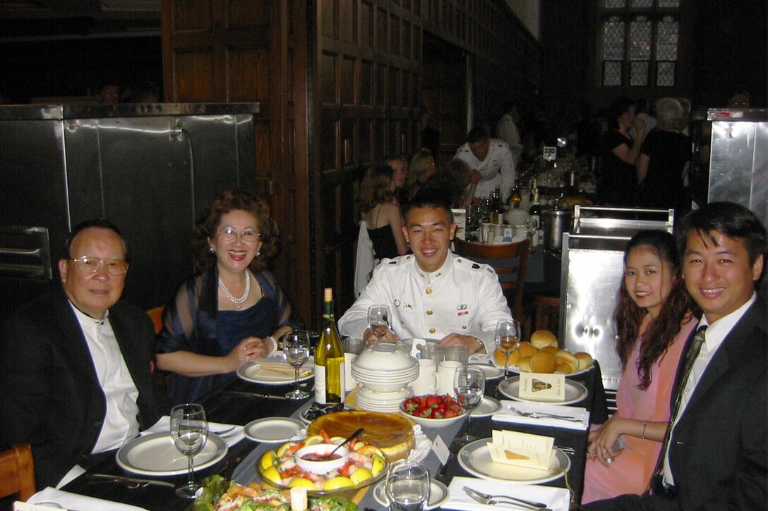 A family celebrates around a table.