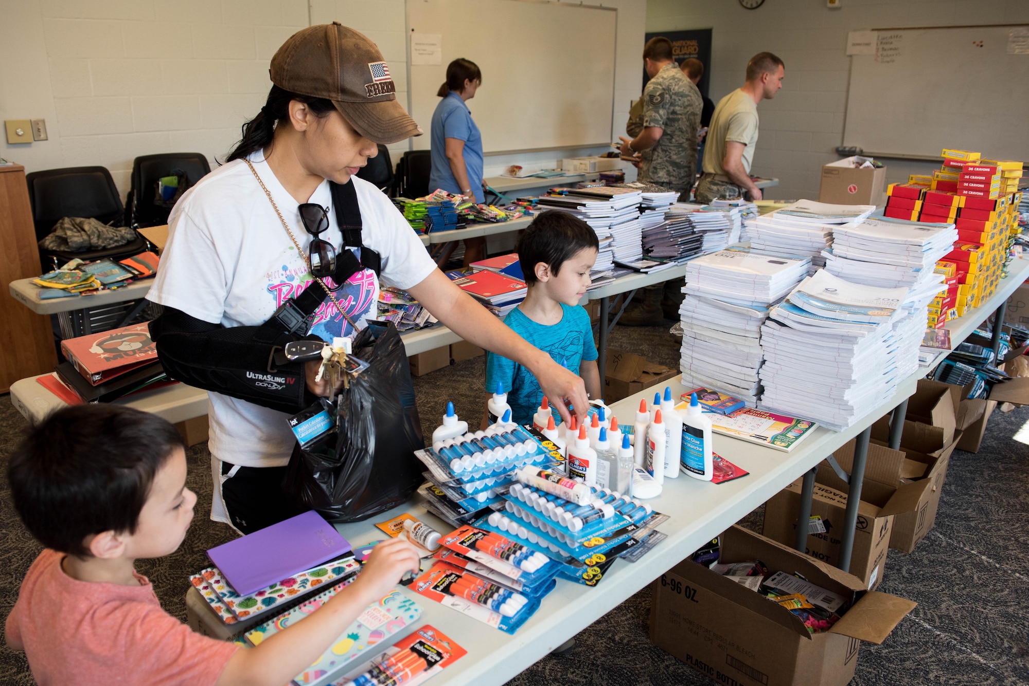 Family looks through school supplies.