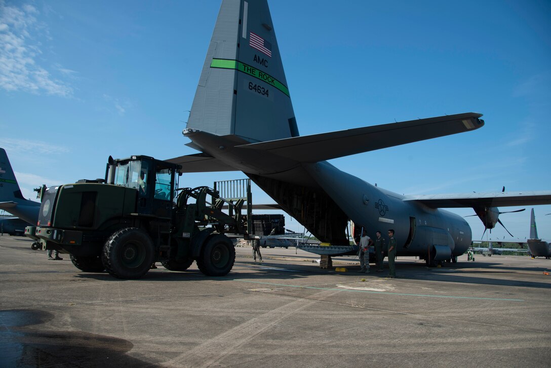 96th Aerial Port Squadron air transportation specialists use a fork lift to place supplies onto a K-loader during static load training on a C-130J Hercules on August 4, 2019 at Little Rock Air Force Base, Arkansas. 96th APS Airmen train regularly to be prepared for deployment operations where they play a critical role in supplying the fight. The combat airlift and airdrop capabilities we provide for all services gives flexibility and agility to combatant commanders. (U.S. Air Force Reserve photo by Senior Airman Chase Cannon)