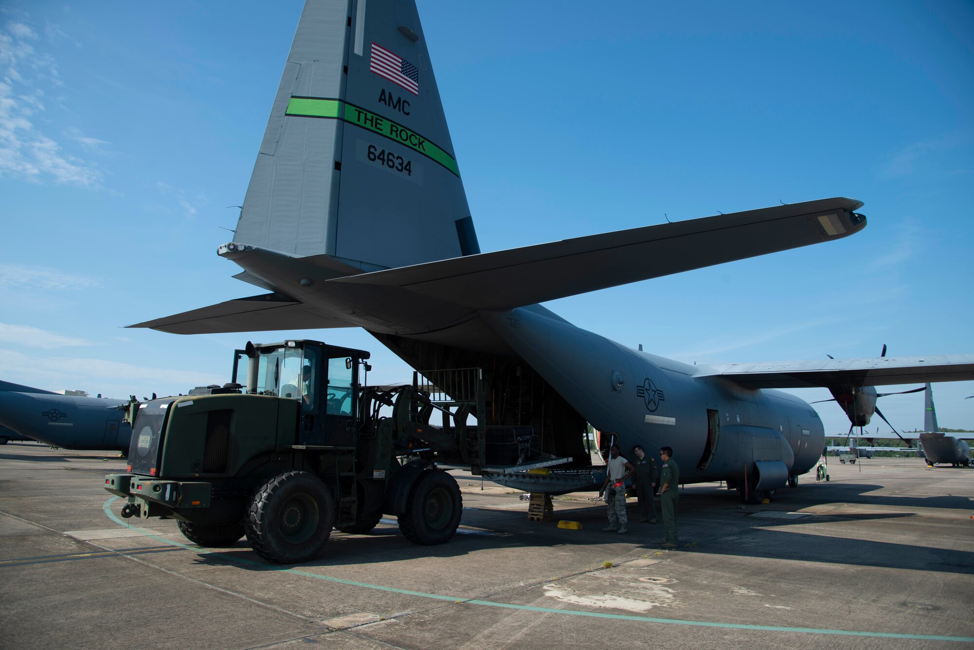 96th Aerial Port Squadron air transportation specialists use a fork lift to load supplies onto a C-130J Hercules during static load training on August 4, 2019 at Little Rock Air Force Base, Arkansas. 96th APS Airmen train regularly to be prepared for deployment operations where they play a critical role in supplying the fight. 96th APS Airmen train regularly to be prepared for deployment operations where they play a critical role in supplying the fight. (U.S. Air Force Reserve photo by Senior Airman Chase Cannon)