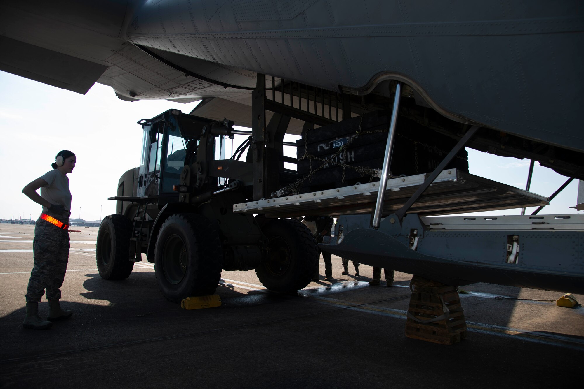 Senior Airman Alexis Docherty, 96th Aerial Port Squadron air transportation specialist, participates in static load training on a C-130J Hercules on August 4, 2019 at Little Rock Air Force Base, Arkansas. 96th APS Airmen train regularly to be prepared for deployment operations where they play a critical role in supplying the fight. LRAFB routinely provides the ability for our nation to project power, often going where others cannot, to support our military partners, intergovernmental agencies, and allied nations to achieve our national security objectives. (U.S. Air Force Reserve photo by Senior Airman Chase Cannon)