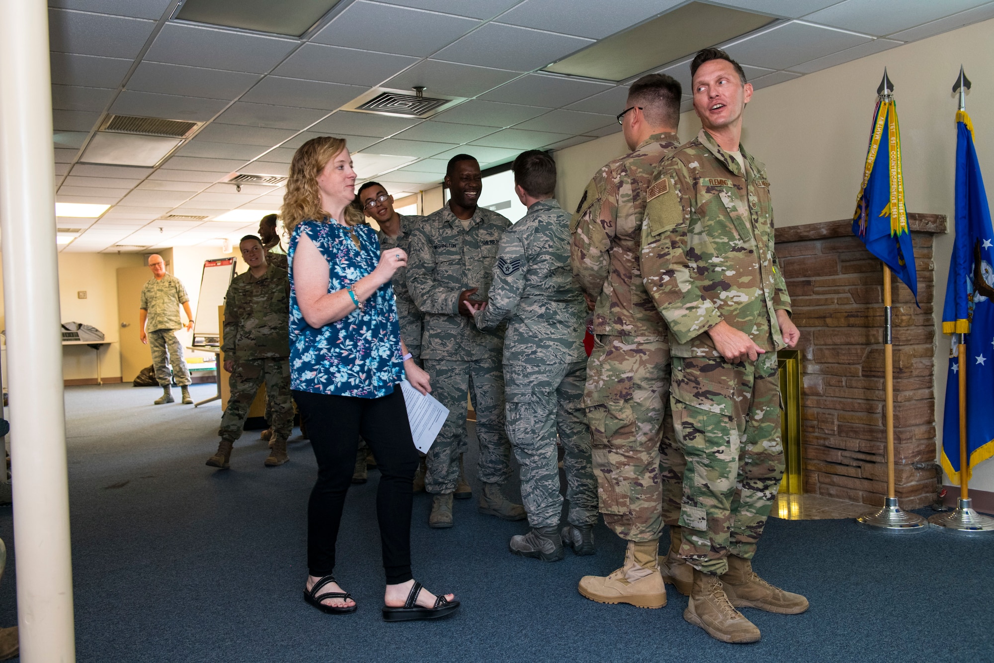 Mrs. Jamie Ellis, 926th Wing Director of Psychological Health, gives an overview to Reserve Citizen Airmen assigned to the 555th RED HORSE Squadron before they participate in a game of telephone Aug. 3, 2019 at Nellis Air Force Base, Nevada, to display how messages can be lost in translation as it is passed to each receiver. Part of the hour-long resiliency event centered on communicating good news – how do you share it and how do you receive it. (U.S. Air Force photo by Senior Airman Brett Clashman)