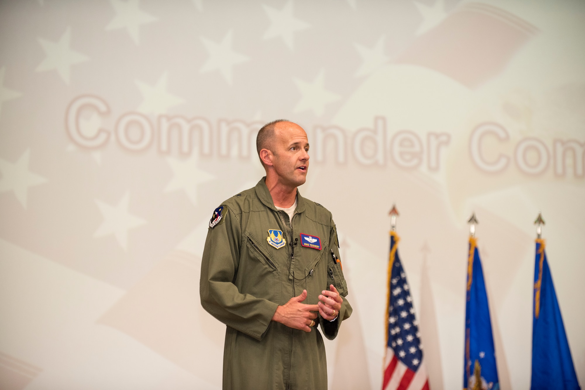 412th Test Wing Commander, Brig. Gen. E. John Teichert, addresses Airmen and civilian personnel during a Commander's Call event at Edwards Air Force Base, California, Aug. 7. (U.S. Air Force photo by Richard Gonzales)