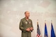 412th Test Wing Commander, Brig. Gen. E. John Teichert, addresses Airmen and civilian personnel during a Commander's Call event at Edwards Air Force Base, California, Aug. 7. (U.S. Air Force photo by Richard Gonzales)