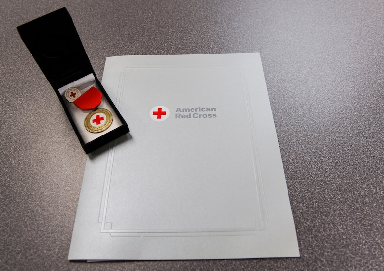 Air Force Academy caregiver, Diane Perez, was awarded the Certificate of Merit by the American Red Cross Aug. 13, 2019, at the U.S. Air Force Academy, Colo. The award is the highest award given by the Red Cross to an individual who saves or sustains a life; it’s signed by the President of the United States. (U.S. Air Force photo by Tech. Sgt. Charles Rivezzo)