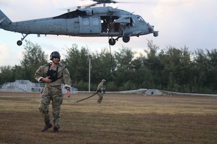 NAVAL BASE GUAM (April 16, 2019) Sailors assigned to Explosive Ordnance Disposal Mobile Unit (EODMU) 5, fast rope out of a MH-60S Seahawk helicopter, attached to Helicopter Sea Combat Squadron (HSC) 25, during the fast rope portion of the Naval Helicopter Rope Suspension Technique (HRST) course. EODMU-5 is assigned to Commander, Navy Expeditionary Forces Pacific, the primary expeditionary task force responsible for the planning and execution of coastal riverine operations, explosive ordnance disposal, diving engineering and construction, and underwater construction in the U.S. 7th Fleet area of operations.