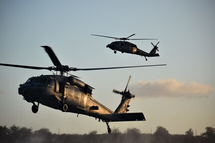 NAVAL BASE GUAM (April 16, 2019) Two MH-60S Seahawk helicopters, attached to Helicopter Sea Combat Squadron (HSC) 25, transport Sailors assigned to Explosive Ordnance Disposal Mobile Unit (EODMU) 5, during the fast rope portion of the Naval Helicopter Rope Suspension Technique (HRST) course. EODMU-5 is assigned to Commander, Navy Expeditionary Forces Pacific, the primary expeditionary task force responsible for the planning and execution of coastal riverine operations, explosive ordnance disposal, diving engineering and construction, and underwater construction in the U.S. 7th Fleet area of operations.