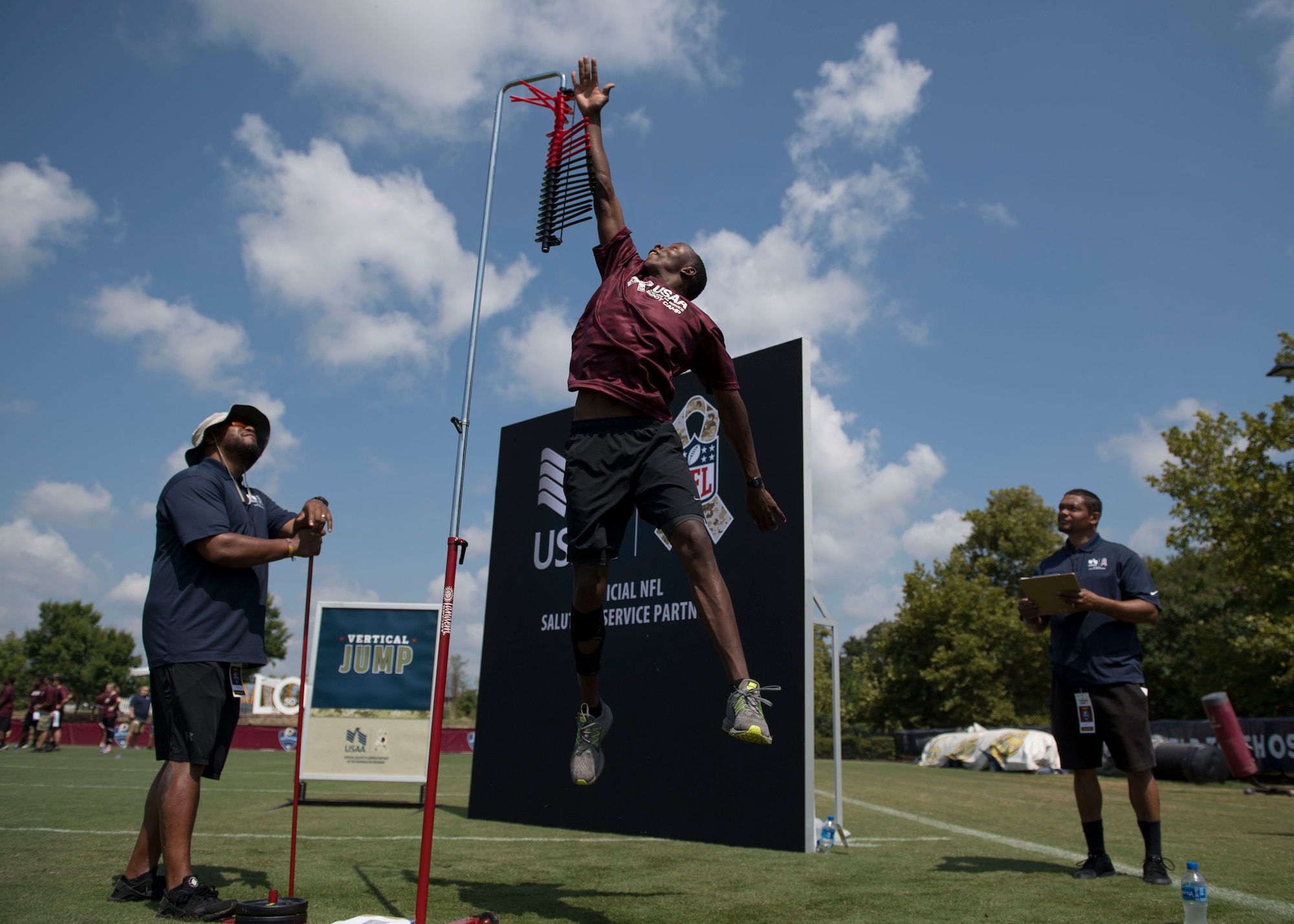 U.S. Air Force Airman Collins Ombikhwa, 633rd Medical Group mental health technician, measures his vertical jump during USAA’s Salute to Service NFL Boot Camp event at the Bon Secours Washington Redskins Training Center, Richmond, Virginia, Aug. 6, 2019.